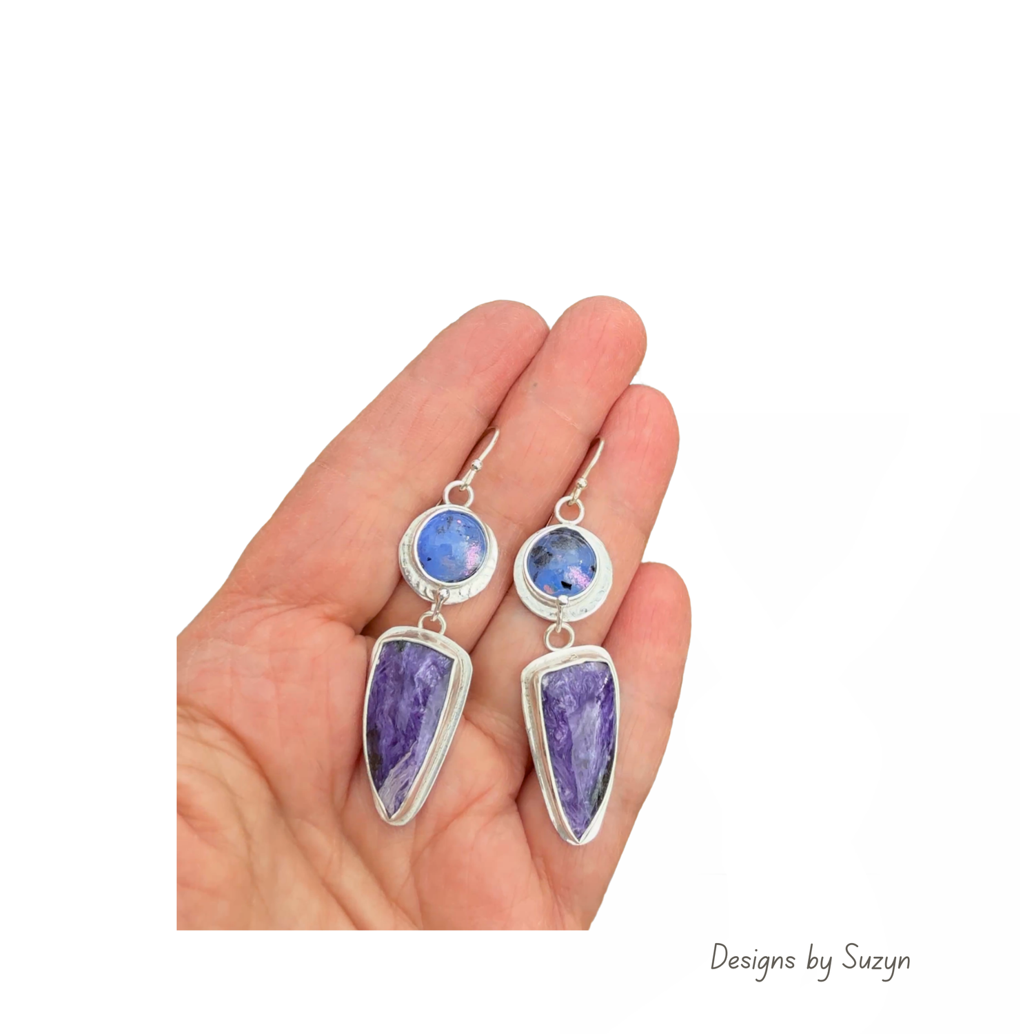 Kiln cast fused glass and charoite statement earrings in sterling silver, shown in an open palm to display their 2-inch length