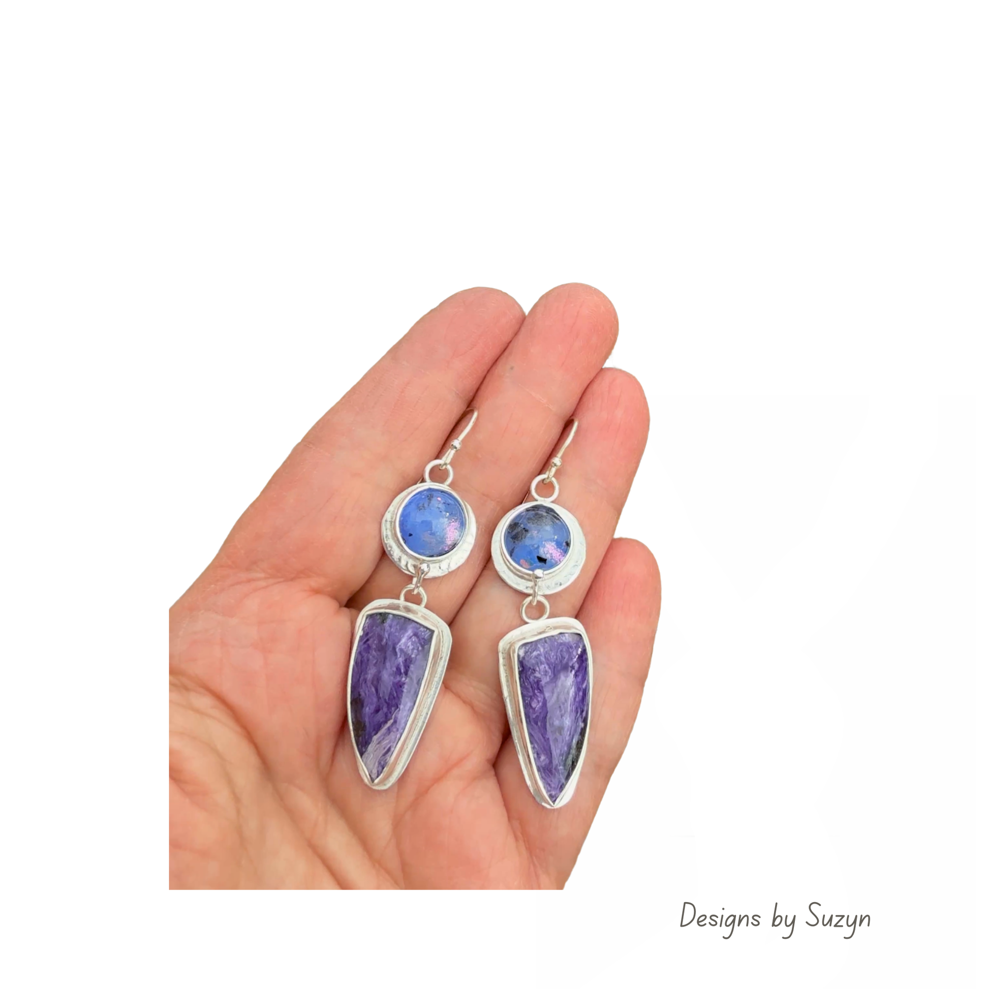 Kiln cast fused glass and charoite statement earrings in sterling silver, shown in an open palm to display their 2-inch length