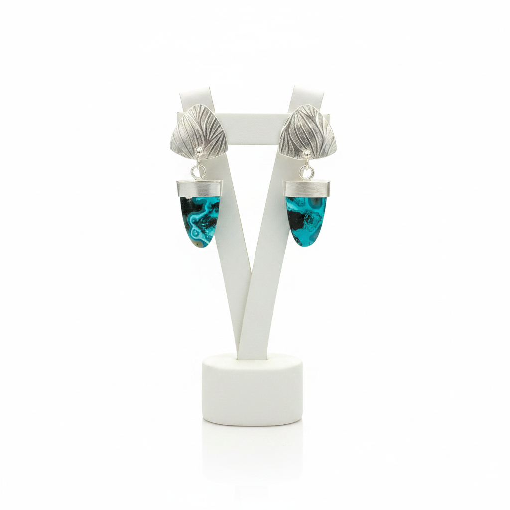 Chrysocolla Earrings Close Together on White Stand