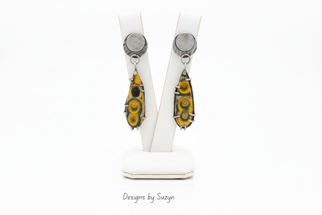 Earrings on Contemporary White Leather Stand