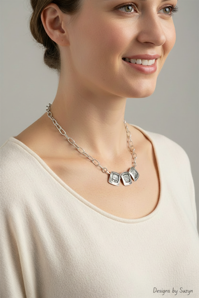 Ancient Glyphs Triptych Necklace worn by model, 3/4 side view with Designs by Suzyn watermark