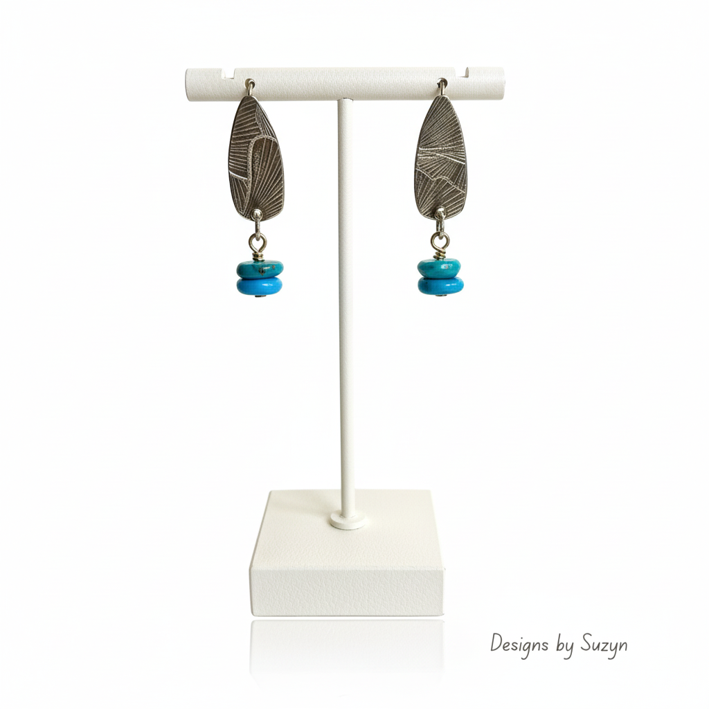 Turquoise Earrings on White Leather Stand